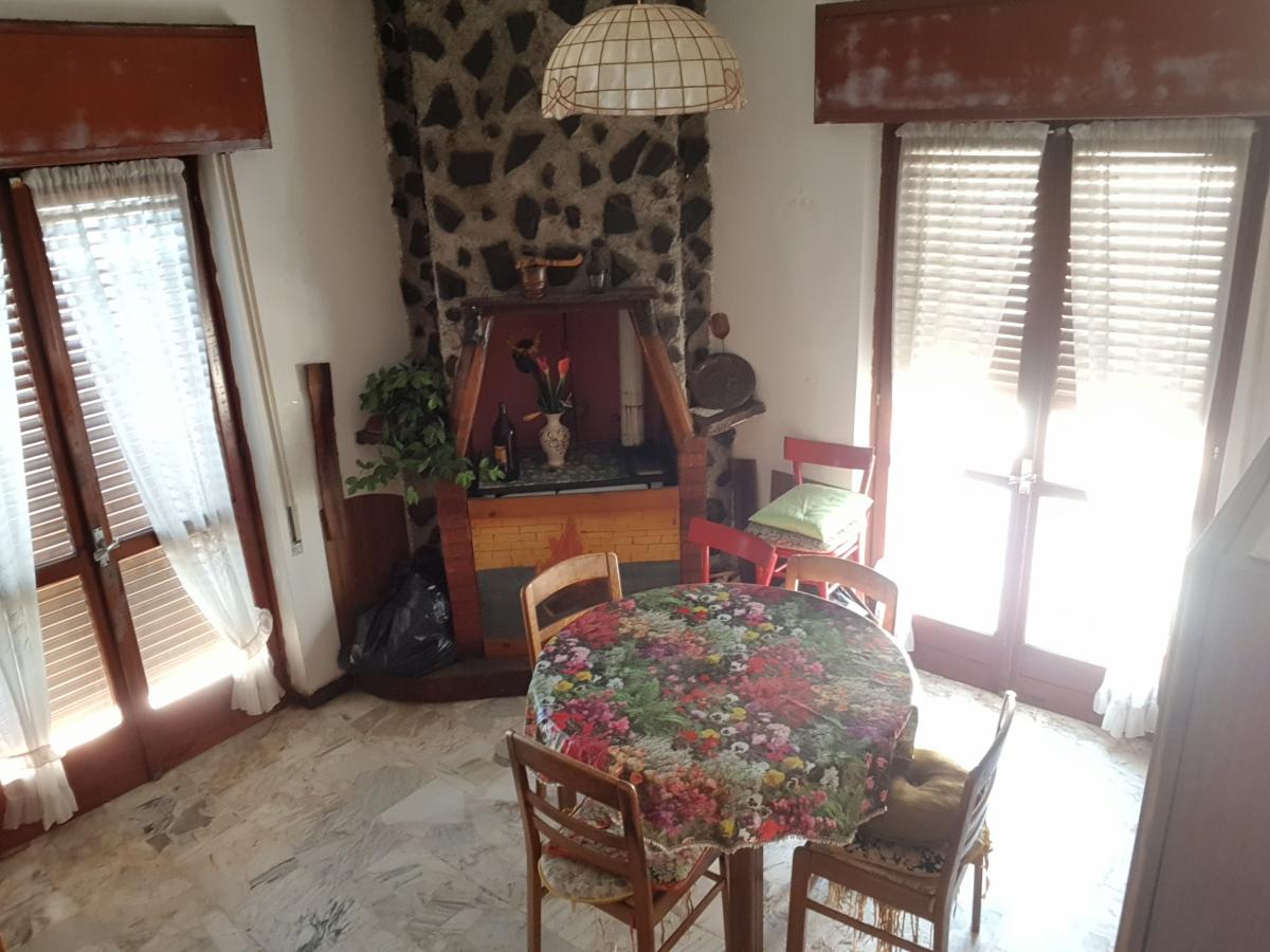 Room with stone fireplace — Building B