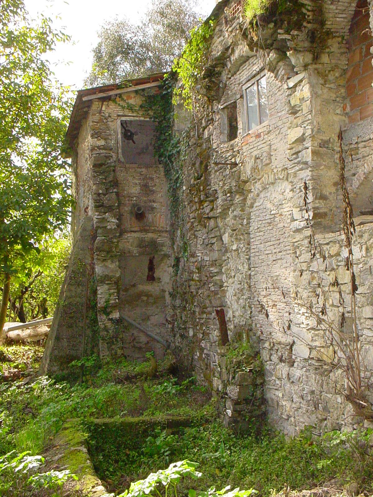 Exterior masonry of Building A with stone channels
